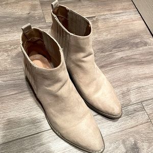 Woman’s tan ankle boots
